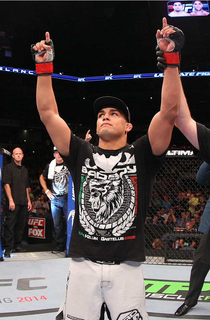 INDIANAPOLIS, IN - AUGUST 28: Kelvin Gastelum reacts after his submission victory over Brian Melancon in their welterweight fight during the UFC on FOX Sports 1 event at Bankers Life Fieldhouse on August 28, 2013 in Indianapolis, Indiana. (Photo by Ed Mu