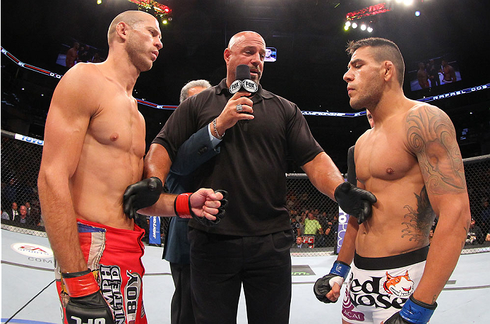 INDIANAPOLIS, IN - AUGUST 28: (L-R) Opponents Donald "Cowboy" Cerrone and Rafael dos Anjos face off before their lightweight fight during the UFC on FOX Sports 1 event at Bankers Life Fieldhouse on August 28, 2013 in Indianapolis, Indiana. (Photo by Ed M