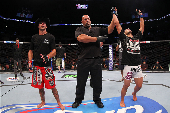 INDIANAPOLIS, IN - AUGUST 28: Rafael dos Anjos (R) reacts after defeating Donald "Cowboy" Cerrone in their lightweight fight during the UFC on FOX Sports 1 event at Bankers Life Fieldhouse on August 28, 2013 in Indianapolis, Indiana. (Photo by Ed Mulholl