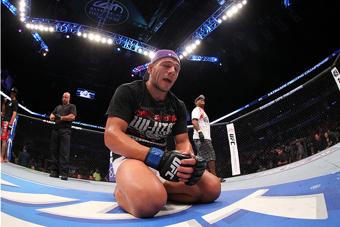 INDIANAPOLIS, IN - AUGUST 28: Rafael dos Anjos reacts after defeating Donald "Cowboy" Cerrone in their lightweight fight during the UFC on FOX Sports 1 event at Bankers Life Fieldhouse on August 28, 2013 in Indianapolis, Indiana. (Photo by Ed Mulholland/
