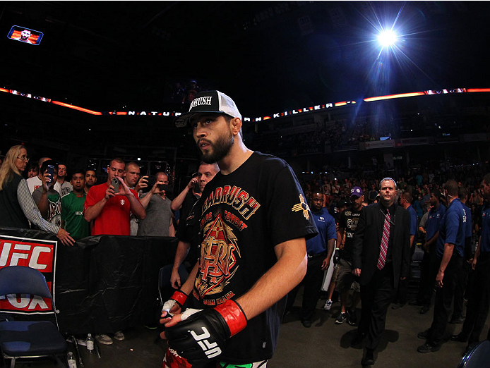 INDIANAPOLIS, IN - AUGUST 28: Carlos Condit enters the arena before his welterweight fight against Martin Kampmann during the UFC on FOX Sports 1 event at Bankers Life Fieldhouse on August 28, 2013 in Indianapolis, Indiana. (Photo by Ed Mulholland/Zuffa