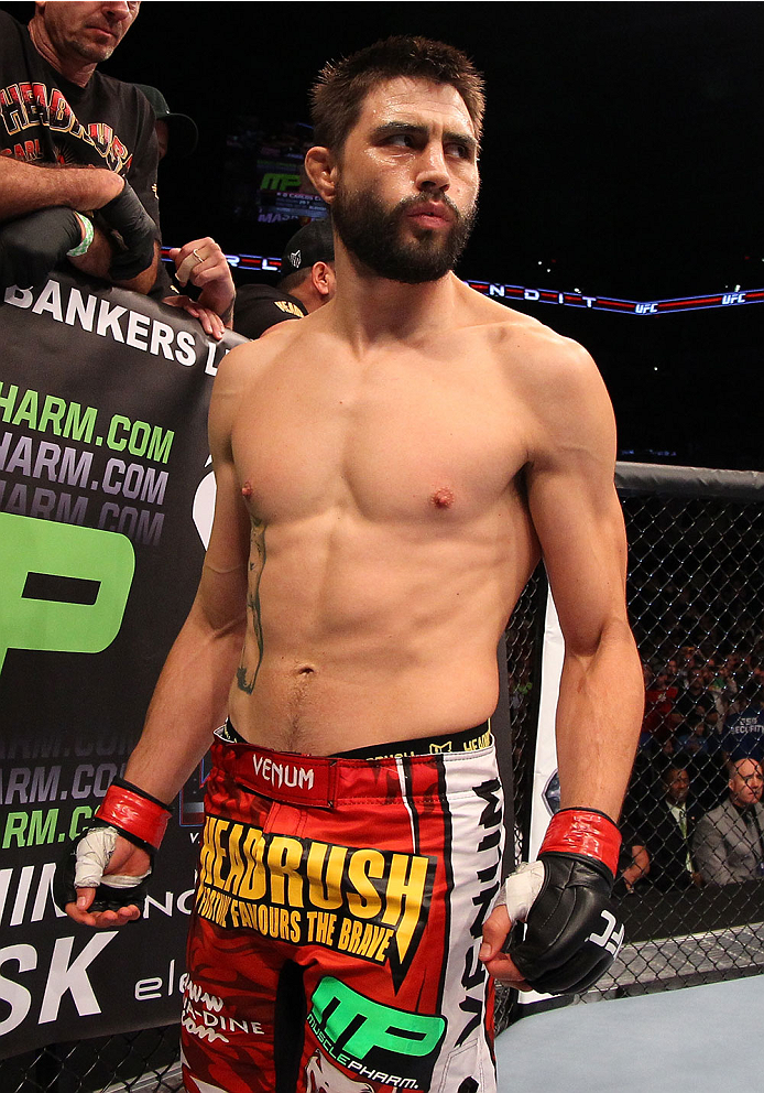 INDIANAPOLIS, IN - AUGUST 28: Carlos Condit stands in the Octagon before his welterweight fight against Martin Kampmann during the UFC on FOX Sports 1 event at Bankers Life Fieldhouse on August 28, 2013 in Indianapolis, Indiana. (Photo by Ed Mulholland/Z