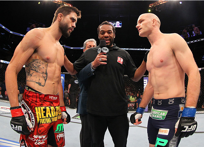 INDIANAPOLIS, IN - AUGUST 28: (L-R) Opponents Carlos Condit and Martin Kampmann face off before their welterweight fight during the UFC on FOX Sports 1 event at Bankers Life Fieldhouse on August 28, 2013 in Indianapolis, Indiana. (Photo by Ed Mulholland/