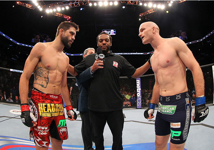 INDIANAPOLIS, IN - AUGUST 28: (L-R) Opponents Carlos Condit and Martin Kampmann face off before their welterweight fight during the UFC on FOX Sports 1 event at Bankers Life Fieldhouse on August 28, 2013 in Indianapolis, Indiana. (Photo by Ed Mulholland/