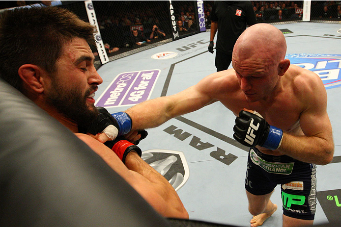 INDIANAPOLIS, IN - AUGUST 28: (R-L) Martin Kampmann punches Carlos Condit in their welterweight fight during the UFC on FOX Sports 1 event at Bankers Life Fieldhouse on August 28, 2013 in Indianapolis, Indiana. (Photo by Ed Mulholland/Zuffa LLC/Zuffa LLC