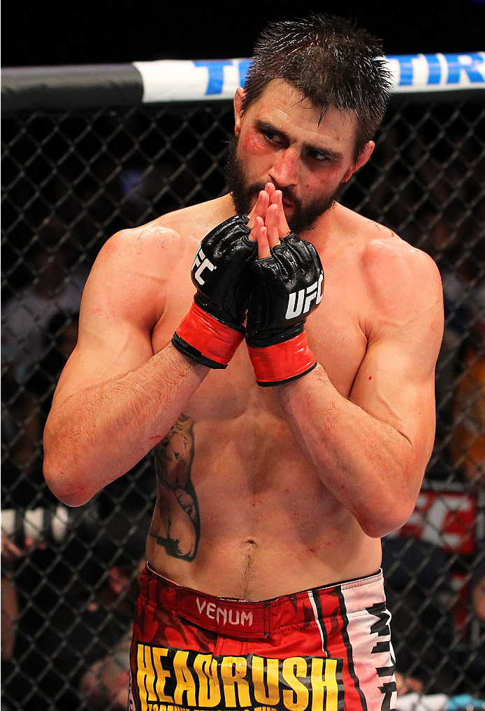 INDIANAPOLIS, IN - AUGUST 28: Carlos Condit reacts after his TKO victory over Martin Kampmann in their welterweight fight during the UFC on FOX Sports 1 event at Bankers Life Fieldhouse on August 28, 2013 in Indianapolis, Indiana. (Photo by Ed Mulholland