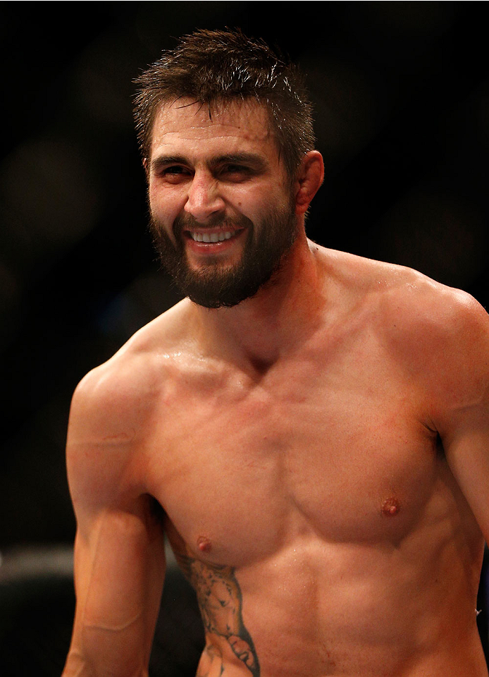 INDIANAPOLIS, IN - AUGUST 28: Carlos Condit reacts after knocking out Martin Kampmann in their welterweight fight during the UFC on FOX Sports 1 event at Bankers Life Fieldhouse on August 28, 2013 in Indianapolis, Indiana. (Photo by Josh Hedges/Zuffa LLC