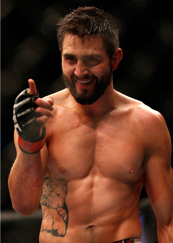INDIANAPOLIS, IN - AUGUST 28: Carlos Condit reacts after knocking out Martin Kampmann in their welterweight fight during the UFC on FOX Sports 1 event at Bankers Life Fieldhouse on August 28, 2013 in Indianapolis, Indiana. (Photo by Josh Hedges/Zuffa LLC