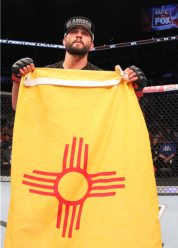 INDIANAPOLIS, IN - AUGUST 28: Carlos Condit reacts after his TKO victory over Martin Kampmann in their welterweight fight during the UFC on FOX Sports 1 event at Bankers Life Fieldhouse on August 28, 2013 in Indianapolis, Indiana. (Photo by Ed Mulholland