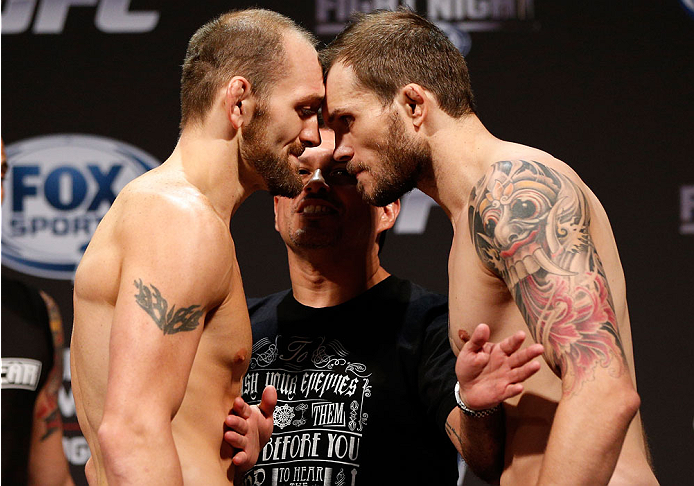 INDIANAPOLIS, IN - AUGUST 27: (L-R) Opponents Zak Cummings and Benny Alloway face off during the UFC weigh-in event at Bankers Life Fieldhouse on August 27, 2013 in Indianapolis, Indiana. (Photo by Josh Hedges/Zuffa LLC/Zuffa LLC via Getty Images)