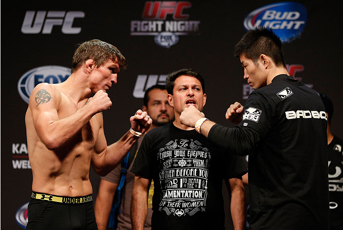INDIANAPOLIS, IN - AUGUST 27: (L-R) Opponents Darren Elkins and Hatsu Hioki face off during the UFC weigh-in event at Bankers Life Fieldhouse on August 27, 2013 in Indianapolis, Indiana. (Photo by Josh Hedges/Zuffa LLC/Zuffa LLC via Getty Images)