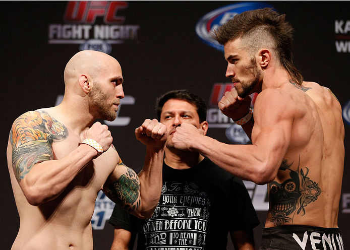INDIANAPOLIS, IN - AUGUST 27: (L-R) Opponents Justin Edwards and Brandon Thatch face off during the UFC weigh-in event at Bankers Life Fieldhouse on August 27, 2013 in Indianapolis, Indiana. (Photo by Josh Hedges/Zuffa LLC/Zuffa LLC via Getty Images)