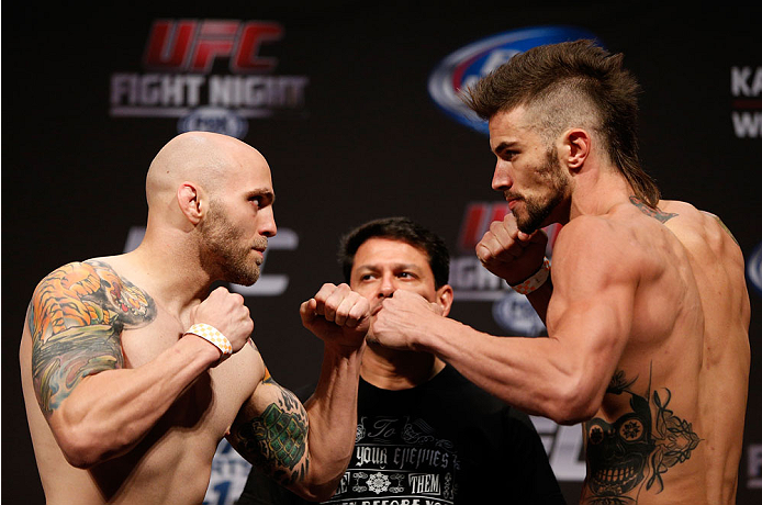 INDIANAPOLIS, IN - AUGUST 27: (L-R) Opponents Justin Edwards and Brandon Thatch face off during the UFC weigh-in event at Bankers Life Fieldhouse on August 27, 2013 in Indianapolis, Indiana. (Photo by Josh Hedges/Zuffa LLC/Zuffa LLC via Getty Images)