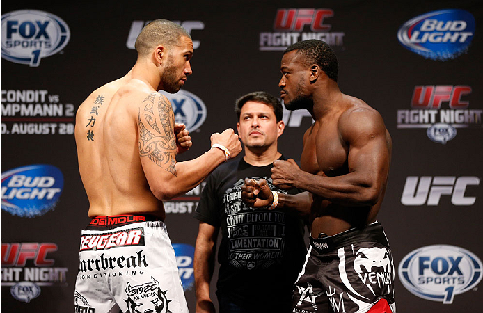INDIANAPOLIS, IN - AUGUST 27: (L-R) Opponents Dylan Andrews and Papy Abedi face off during the UFC weigh-in event at Bankers Life Fieldhouse on August 27, 2013 in Indianapolis, Indiana. (Photo by Josh Hedges/Zuffa LLC/Zuffa LLC via Getty Images)