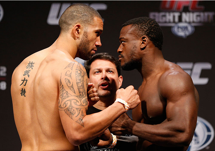 INDIANAPOLIS, IN - AUGUST 27: (L-R) Opponents Dylan Andrews and Papy Abedi face off during the UFC weigh-in event at Bankers Life Fieldhouse on August 27, 2013 in Indianapolis, Indiana. (Photo by Josh Hedges/Zuffa LLC/Zuffa LLC via Getty Images)