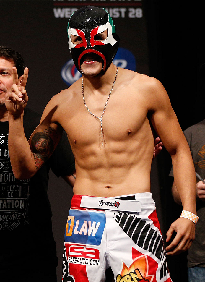 INDIANAPOLIS, IN - AUGUST 27: Erik Perez poses for photos during the UFC weigh-in event at Bankers Life Fieldhouse on August 27, 2013 in Indianapolis, Indiana. (Photo by Josh Hedges/Zuffa LLC/Zuffa LLC via Getty Images)