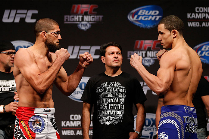 INDIANAPOLIS, IN - AUGUST 27: (L-R) Opponents Court McGee and Robert Whittaker face off during the UFC weigh-in event at Bankers Life Fieldhouse on August 27, 2013 in Indianapolis, Indiana. (Photo by Josh Hedges/Zuffa LLC/Zuffa LLC via Getty Images)