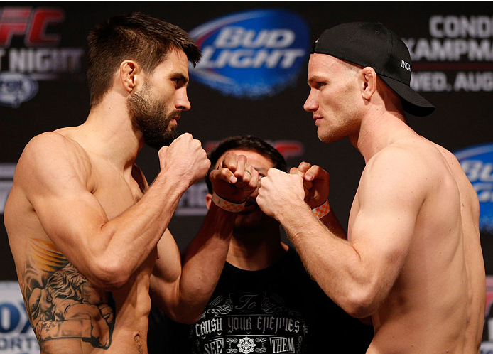 INDIANAPOLIS, IN - AUGUST 27: (L-R) Opponents Carlos Condit and Martin Kampmann face off during the UFC weigh-in event at Bankers Life Fieldhouse on August 27, 2013 in Indianapolis, Indiana. (Photo by Josh Hedges/Zuffa LLC/Zuffa LLC via Getty Images)
