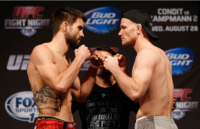 INDIANAPOLIS, IN - AUGUST 27: (L-R) Opponents Carlos Condit and Martin Kampmann face off during the UFC weigh-in event at Bankers Life Fieldhouse on August 27, 2013 in Indianapolis, Indiana. (Photo by Josh Hedges/Zuffa LLC/Zuffa LLC via Getty Images)
