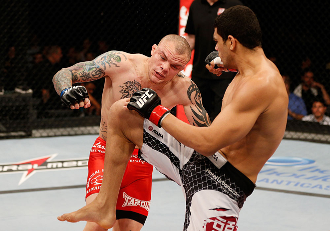 FORTALEZA, BRAZIL - JUNE 08: (R-L) Antonio Braga Neto knees Anthony Smith in their middleweight fight during the UFC on FUEL TV event at Paulo Sarasate Arena on June 8, 2013 in Fortaleza, Ceara, Brazil. (Photo by Josh Hedges/Zuffa LLC/Zuffa LLC via Gett