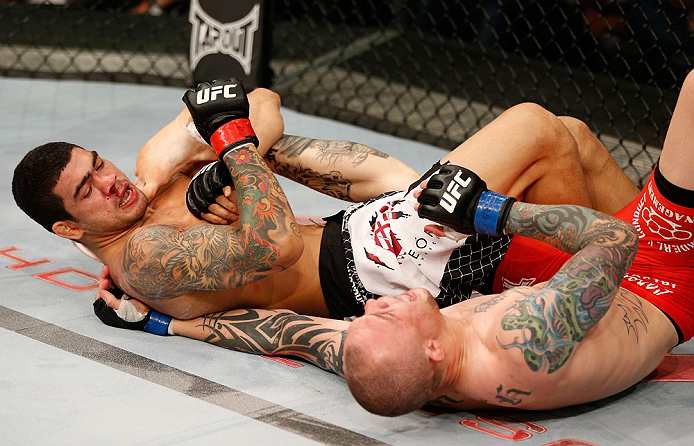 FORTALEZA, BRAZIL - JUNE 08: (L-R) Antonio Braga Neto secures a knee bar submission against Anthony Smith in their middleweight fight during the UFC on FUEL TV event at Paulo Sarasate Arena on June 8, 2013 in Fortaleza, Ceara, Brazil. (Photo by Josh Hed