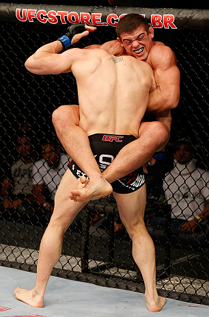 FORTALEZA, BRAZIL - JUNE 08: Caio Magalhaes (top) attempts a guillotine choke against Karlos Vemola in their middleweight fight during the UFC on FUEL TV event at Paulo Sarasate Arena on June 8, 2013 in Fortaleza, Ceara, Brazil. (Photo by Josh Hedges/Zu