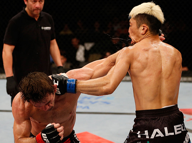 FORTALEZA, BRAZIL - JUNE 08: (L-R) Rodrigo Damm and Mizuto Hirota trade punches in their featherweight fight during the UFC on FUEL TV event at Paulo Sarasate Arena on June 8, 2013 in Fortaleza, Ceara, Brazil. (Photo by Josh Hedges/Zuffa LLC/Zuffa LLC v