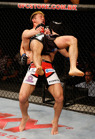 FORTALEZA, BRAZIL - JUNE 08: Rodrigo Damm suplexes Mizuto Hirota in their featherweight fight during the UFC on FUEL TV event at Paulo Sarasate Arena on June 8, 2013 in Fortaleza, Ceara, Brazil. (Photo by Josh Hedges/Zuffa LLC/Zuffa LLC via Getty Images