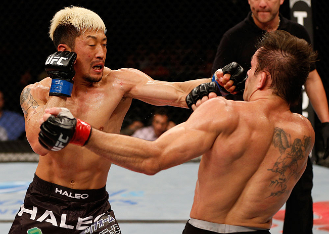 FORTALEZA, BRAZIL - JUNE 08: (L-R) Mizuto Hirota punches Rodrigo Damm in their featherweight fight during the UFC on FUEL TV event at Paulo Sarasate Arena on June 8, 2013 in Fortaleza, Ceara, Brazil. (Photo by Josh Hedges/Zuffa LLC/Zuffa LLC via Getty I