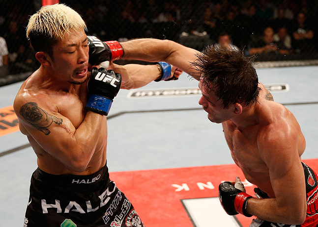 FORTALEZA, BRAZIL - JUNE 08: (R-L) Rodrigo Damm punches Mizuto Hirota in their featherweight fight during the UFC on FUEL TV event at Paulo Sarasate Arena on June 8, 2013 in Fortaleza, Ceara, Brazil. (Photo by Josh Hedges/Zuffa LLC/Zuffa LLC via Getty I