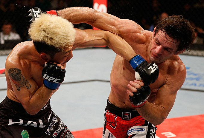 FORTALEZA, BRAZIL - JUNE 08: (R-L) Rodrigo Damm and Mizuto Hirota trade punches in their featherweight fight during the UFC on FUEL TV event at Paulo Sarasate Arena on June 8, 2013 in Fortaleza, Ceara, Brazil. (Photo by Josh Hedges/Zuffa LLC/Zuffa LLC v
