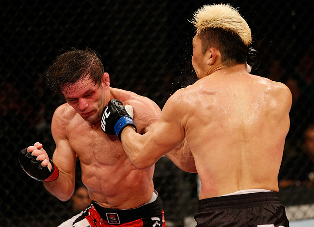 FORTALEZA, BRAZIL - JUNE 08: (L-R) Rodrigo Damm and Mizuto Hirota trade punches in their featherweight fight during the UFC on FUEL TV event at Paulo Sarasate Arena on June 8, 2013 in Fortaleza, Ceara, Brazil. (Photo by Josh Hedges/Zuffa LLC/Zuffa LLC v