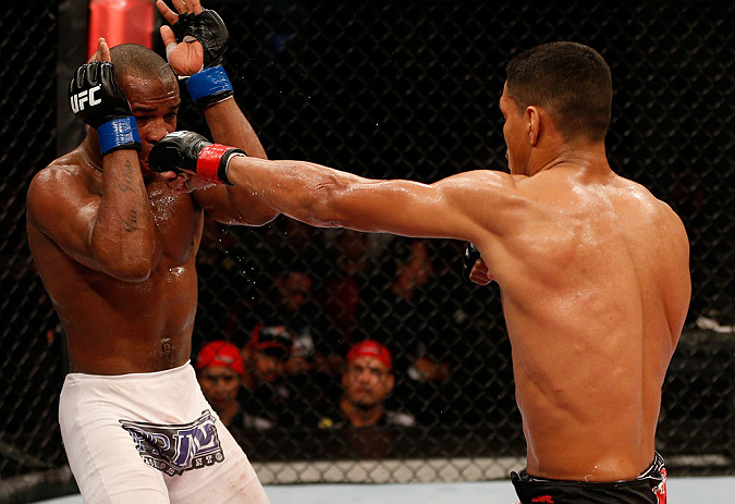 FORTALEZA, BRAZIL - JUNE 08: (R-L) Ildemar Alcantara punches Leandro Silva in their welterweight fight during the UFC on FUEL TV event at Paulo Sarasate Arena on June 8, 2013 in Fortaleza, Ceara, Brazil. (Photo by Josh Hedges/Zuffa LLC/Zuffa LLC via Get