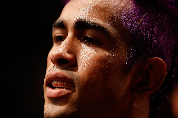 FORTALEZA, BRAZIL - JUNE 08: (L-R) Godofredo "Pepey" Castro prepares to enter the Octagon before his featherweight fight against Felipe Arantes during the UFC on FUEL TV event at Paulo Sarasate Arena on June 8, 2013 in Fortaleza, Ceara, Brazil. (Photo b