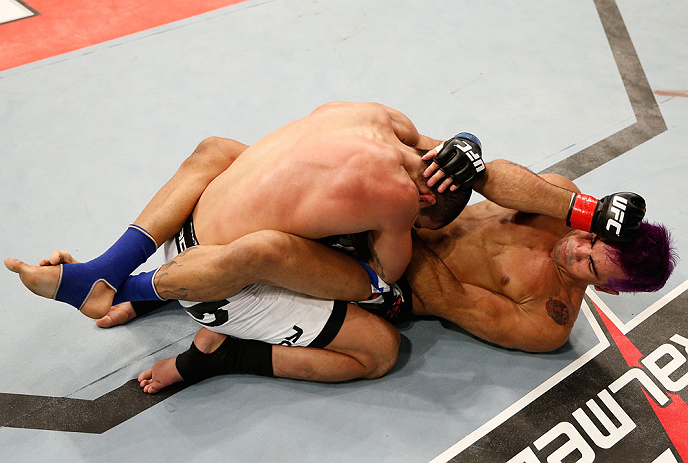 FORTALEZA, BRAZIL - JUNE 08: (R-L) Godofredo "Pepey" Castro elbows Felipe Arantes in their featherweight fight during the UFC on FUEL TV event at Paulo Sarasate Arena on June 8, 2013 in Fortaleza, Ceara, Brazil. (Photo by Josh Hedges/Zuffa LLC/Zuffa LLC