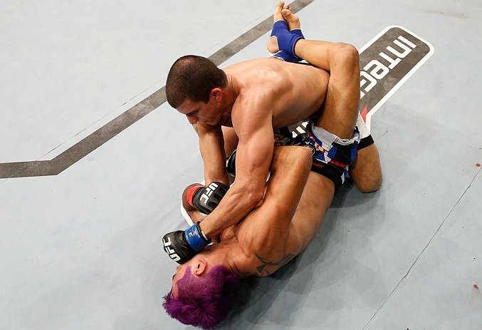 FORTALEZA, BRAZIL - JUNE 08: Felipe Arantes (top) punches Godofredo "Pepey" Castro in their featherweight fight during the UFC on FUEL TV event at Paulo Sarasate Arena on June 8, 2013 in Fortaleza, Ceara, Brazil. (Photo by Josh Hedges/Zuffa LLC/Zuffa LL