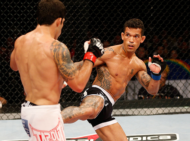 FORTALEZA, BRAZIL - JUNE 08: (R-L) Vaughan Lee kicks Raphael Assuncao in their bantamweight fight during the UFC on FUEL TV event at Paulo Sarasate Arena on June 8, 2013 in Fortaleza, Ceara, Brazil. (Photo by Josh Hedges/Zuffa LLC/Zuffa LLC via Getty Im