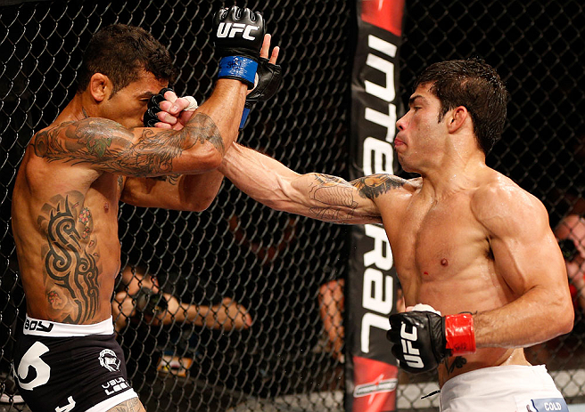 FORTALEZA, BRAZIL - JUNE 08: (R-L) Raphael Assuncao punches Vaughan Lee in their bantamweight fight during the UFC on FUEL TV event at Paulo Sarasate Arena on June 8, 2013 in Fortaleza, Ceara, Brazil. (Photo by Josh Hedges/Zuffa LLC/Zuffa LLC via Getty