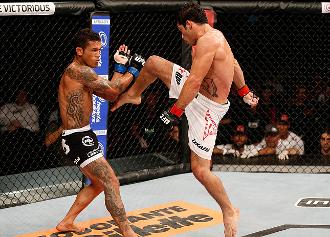 FORTALEZA, BRAZIL - JUNE 08: (R-L) Raphael Assuncao throws a flying knee against Vaughan Lee in their bantamweight fight during the UFC on FUEL TV event at Paulo Sarasate Arena on June 8, 2013 in Fortaleza, Ceara, Brazil. (Photo by Josh Hedges/Zuffa LLC