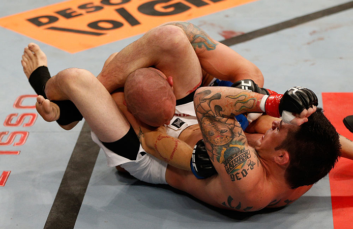 FORTALEZA, BRAZIL - JUNE 08: (R-L) Rony "Jason" Mariano Bezerra elbow Mike Wilkinson as he secures a triangle choke submission in their featherweight fight during the UFC on FUEL TV event at Paulo Sarasate Arena on June 8, 2013 in Fortaleza, Ceara, Brazi