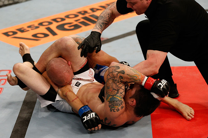 FORTALEZA, BRAZIL - JUNE 08: (R-L) Rony "Jason" Mariano Bezerra elbow Mike Wilkinson as he secures a triangle choke submission in their featherweight fight during the UFC on FUEL TV event at Paulo Sarasate Arena on June 8, 2013 in Fortaleza, Ceara, Brazi