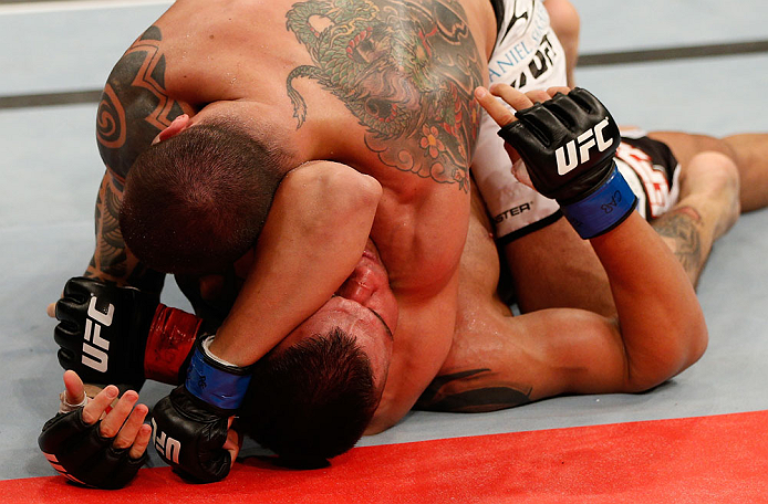 FORTALEZA, BRAZIL - JUNE 08: (L-R) Daniel Sarafian secures an arm triangle choke submission against Eddie Mendez in their middleweight fight during the UFC on FUEL TV event at Paulo Sarasate Arena on June 8, 2013 in Fortaleza, Ceara, Brazil. (Photo by J