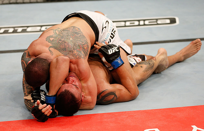 FORTALEZA, BRAZIL - JUNE 08: (L-R) Daniel Sarafian secures an arm triangle choke submission against Eddie Mendez in their middleweight fight during the UFC on FUEL TV event at Paulo Sarasate Arena on June 8, 2013 in Fortaleza, Ceara, Brazil. (Photo by J