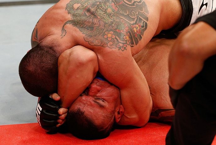 FORTALEZA, BRAZIL - JUNE 08: (L-R) Daniel Sarafian secures an arm triangle choke submission against Eddie Mendez in their middleweight fight during the UFC on FUEL TV event at Paulo Sarasate Arena on June 8, 2013 in Fortaleza, Ceara, Brazil. (Photo by J