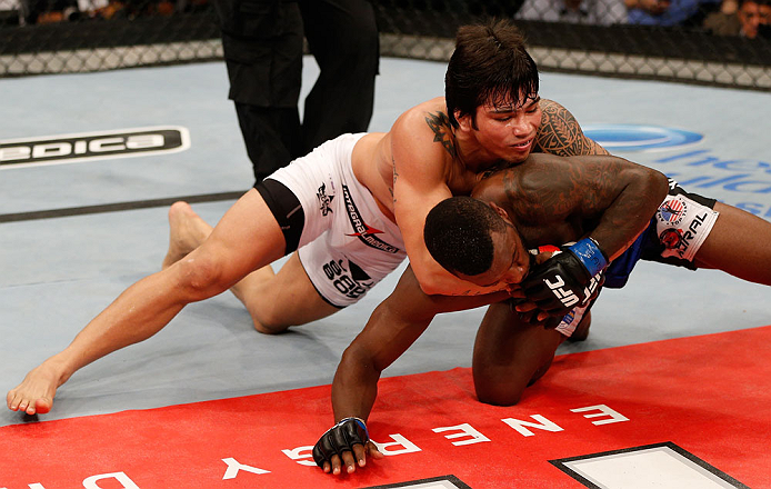 FORTALEZA, BRAZIL - JUNE 08: (L-R) Erick Silva grapples with Jason High in their welterweight fight during the UFC on FUEL TV event at Paulo Sarasate Arena on June 8, 2013 in Fortaleza, Ceara, Brazil. (Photo by Josh Hedges/Zuffa LLC/Zuffa LLC via Getty