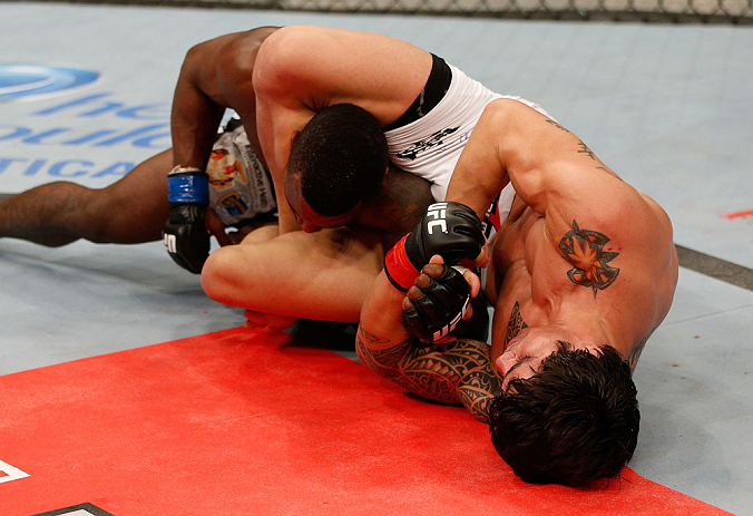 FORTALEZA, BRAZIL - JUNE 08: (R-L) Erick Silva secures an arm bar submission against Jason High in their welterweight fight during the UFC on FUEL TV event at Paulo Sarasate Arena on June 8, 2013 in Fortaleza, Ceara, Brazil. (Photo by Josh Hedges/Zuffa