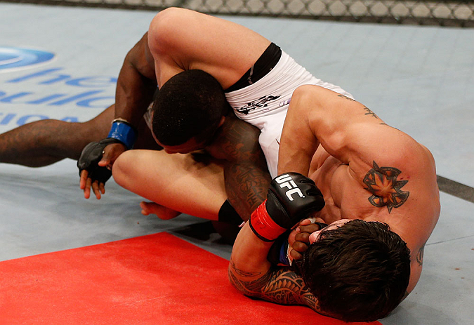 FORTALEZA, BRAZIL - JUNE 08: (R-L) Erick Silva secures an arm bar submission against Jason High in their welterweight fight during the UFC on FUEL TV event at Paulo Sarasate Arena on June 8, 2013 in Fortaleza, Ceara, Brazil. (Photo by Josh Hedges/Zuffa