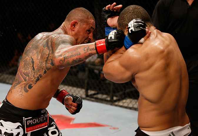 FORTALEZA, BRAZIL - JUNE 08: (L-R) Thiago Silva punches Rafael "Feijao" Cavalcante in their light heavyweight fight during the UFC on FUEL TV event at Paulo Sarasate Arena on June 8, 2013 in Fortaleza, Ceara, Brazil. (Photo by Josh Hedges/Zuffa LLC/Zuff