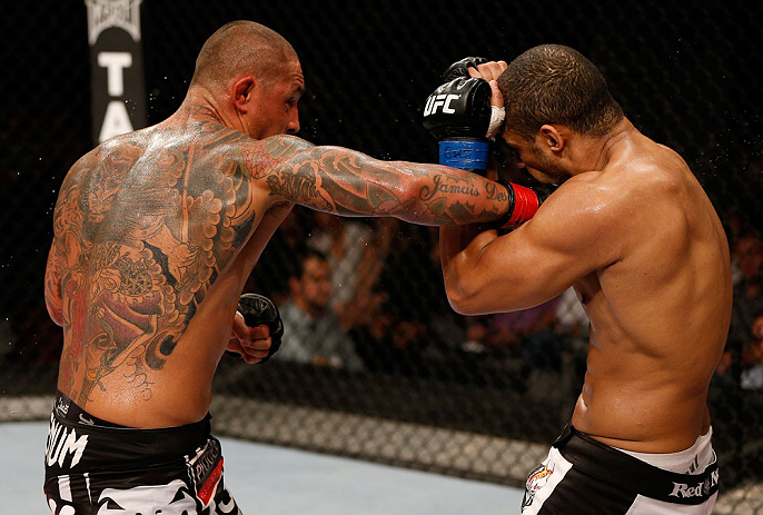 FORTALEZA, BRAZIL - JUNE 08: (L-R) Thiago Silva punches Rafael "Feijao" Cavalcante in their light heavyweight fight during the UFC on FUEL TV event at Paulo Sarasate Arena on June 8, 2013 in Fortaleza, Ceara, Brazil. (Photo by Josh Hedges/Zuffa LLC/Zuff