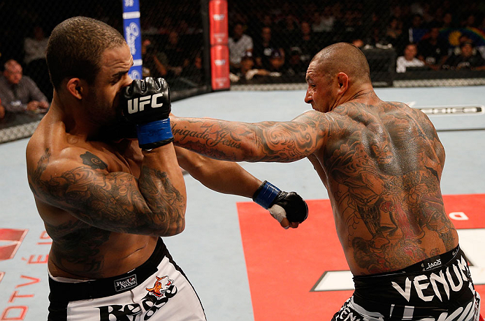 FORTALEZA, BRAZIL - JUNE 08: (R-L) Thiago Silva punches Rafael "Feijao" Cavalcante in their light heavyweight fight during the UFC on FUEL TV event at Paulo Sarasate Arena on June 8, 2013 in Fortaleza, Ceara, Brazil. (Photo by Josh Hedges/Zuffa LLC/Zuff